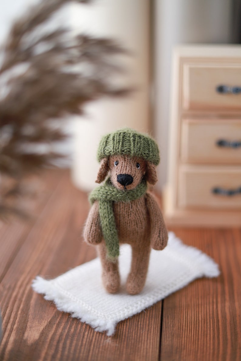 Cute knitted puppy in a hat and scarf Knitting pattern