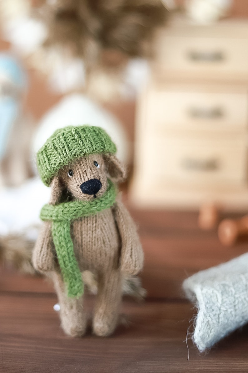 Cute knitted puppy in a hat and scarf Knitting pattern